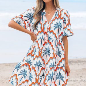 Vestido fluido de manga corta con estampado de palmeras en contraste naranja